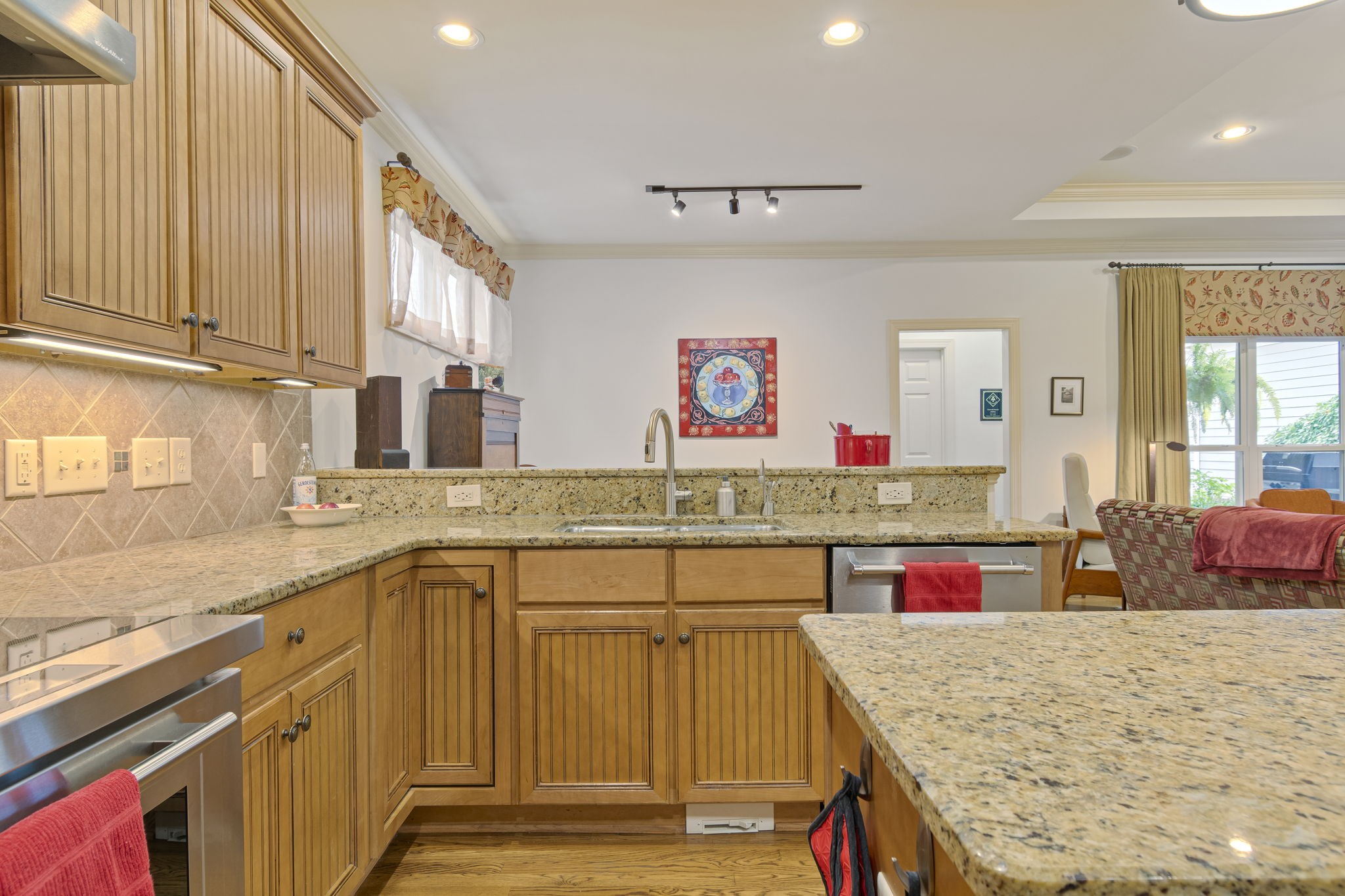 713 Pearre Springs Way Franklin, TN 37064 - Photo 39 of 95 a kitchen with stainless steel appliances granite countertop a sink stove and cabinets