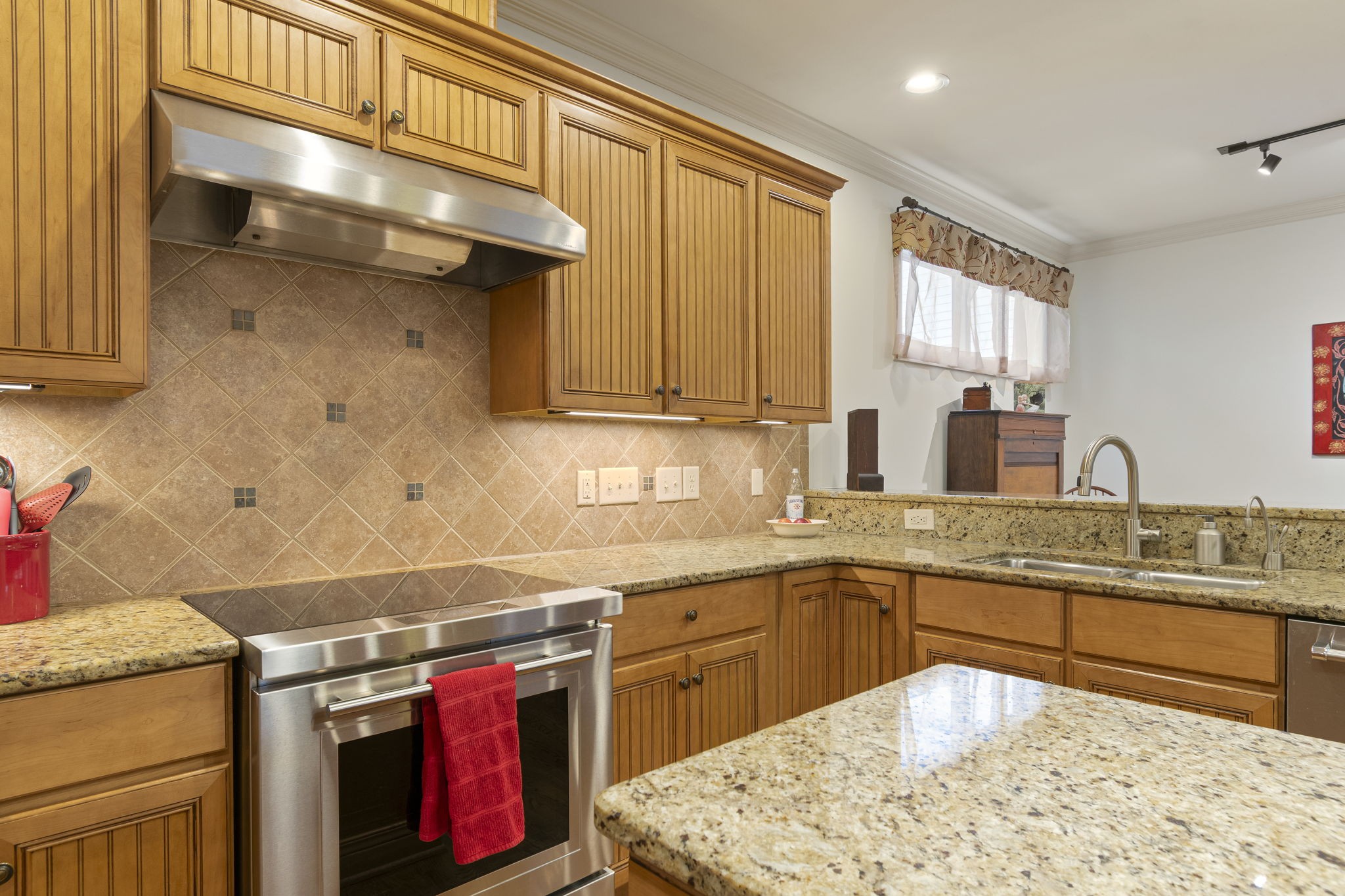 713 Pearre Springs Way Franklin, TN 37064 - Photo 40 of 95 a kitchen with stainless steel appliances granite countertop a sink stove and cabinets