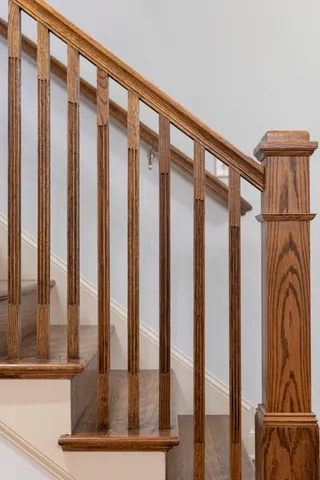 a living room with furniture a flat screen tv and a table