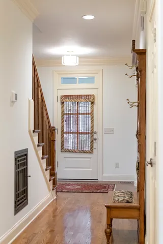 a view of a patio with table and chairs and potted plants