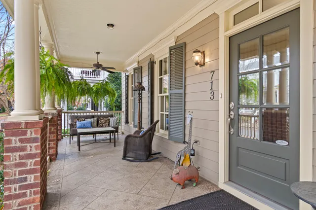 a view of a dining room with furniture wooden floor and chandelier