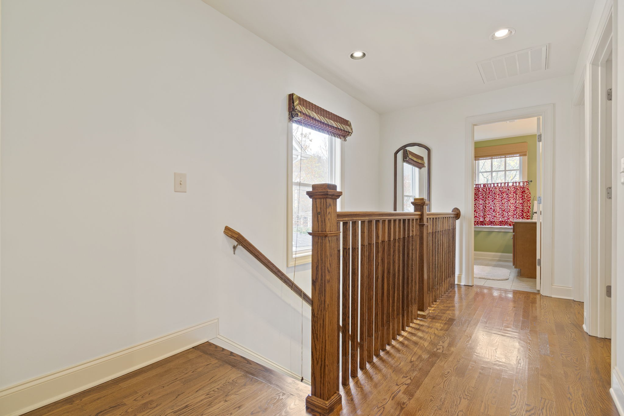 713 Pearre Springs Way Franklin, TN 37064 - Photo 75 of 95 a view of a hallway with wooden floor and stairs