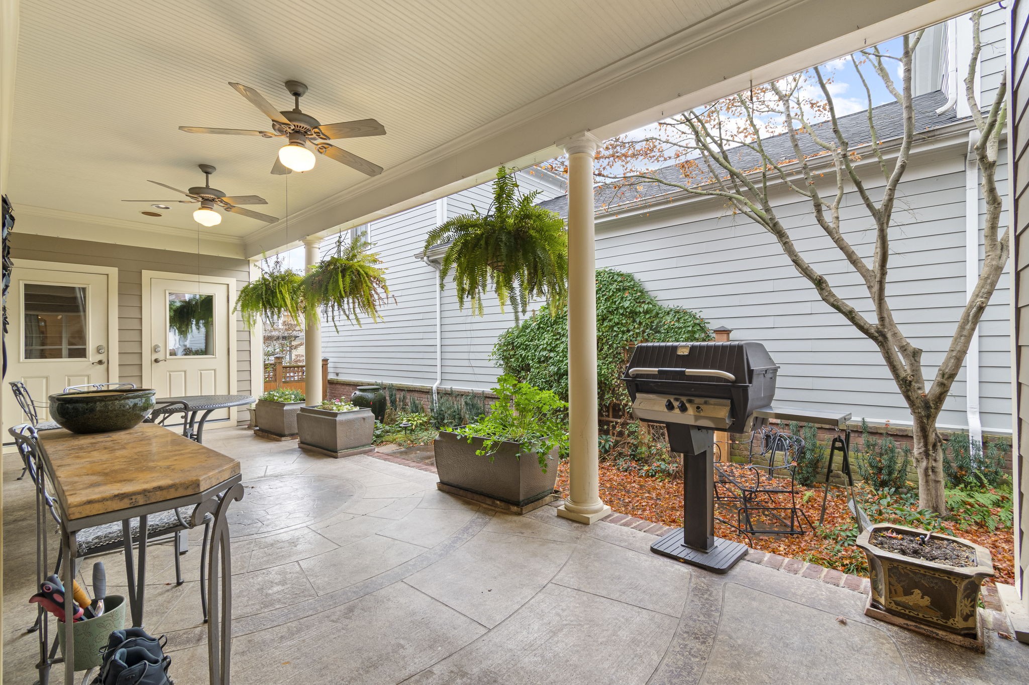 713 Pearre Springs Way Franklin, TN 37064 - Photo 88 of 95 a view of a patio with table and chairs and potted plants