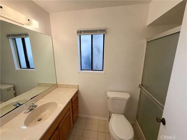 a view of an empty room with a fireplace