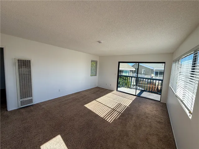 a bathroom with a granite countertop sink mirror and shower
