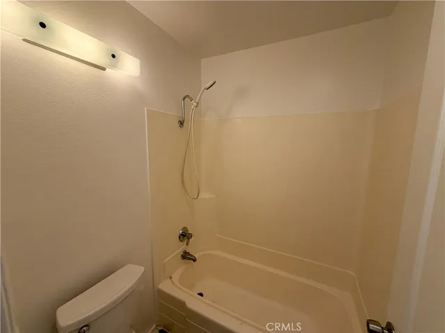 a view of a balcony with wooden floor