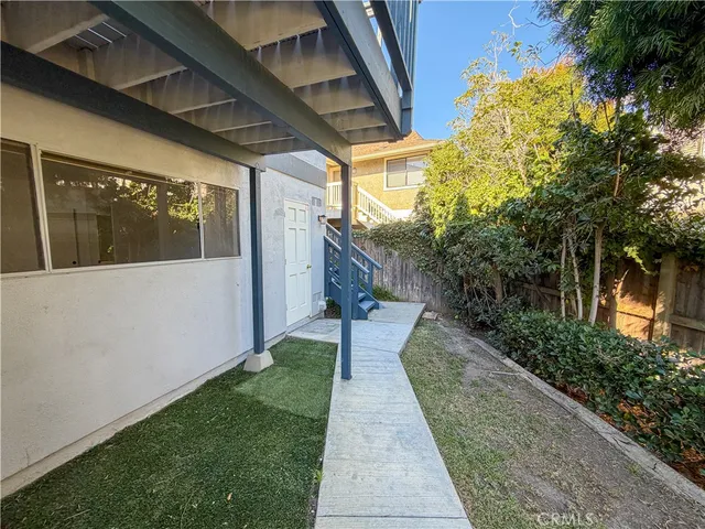a kitchen with granite countertop a sink stove and cabinets