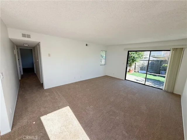 a kitchen with a stove sink and a refrigerator