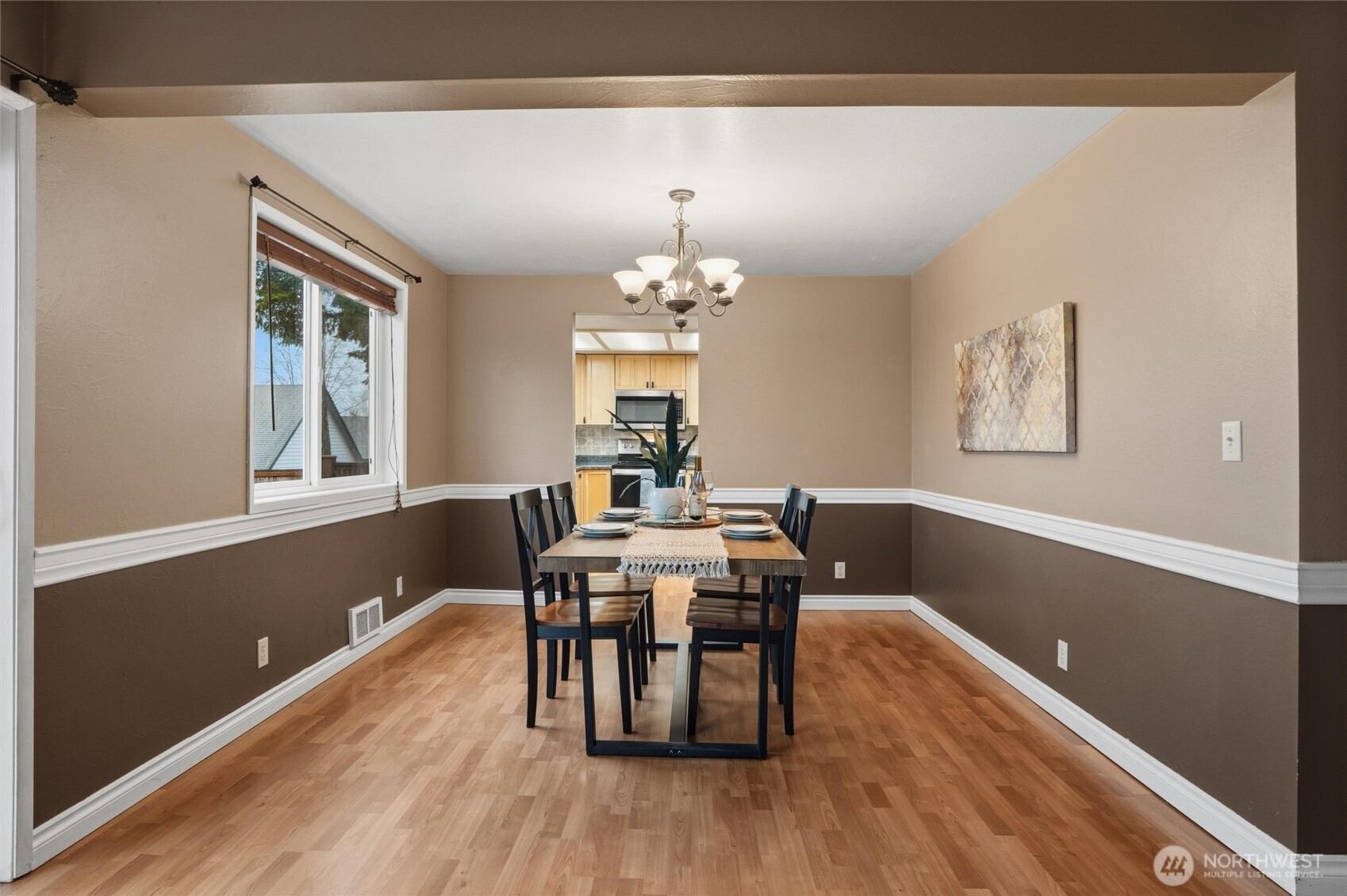 19855 Stavanger Loop Northeast Poulsbo, WA 98370 - Photo 14 of 37 a view of a dining room with furniture window and wooden floor