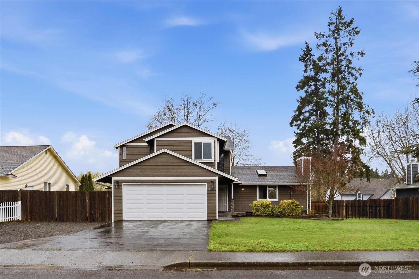 19855 Stavanger Loop Northeast Poulsbo, WA 98370 - Photo 2 of 37 front view of a house with a yard