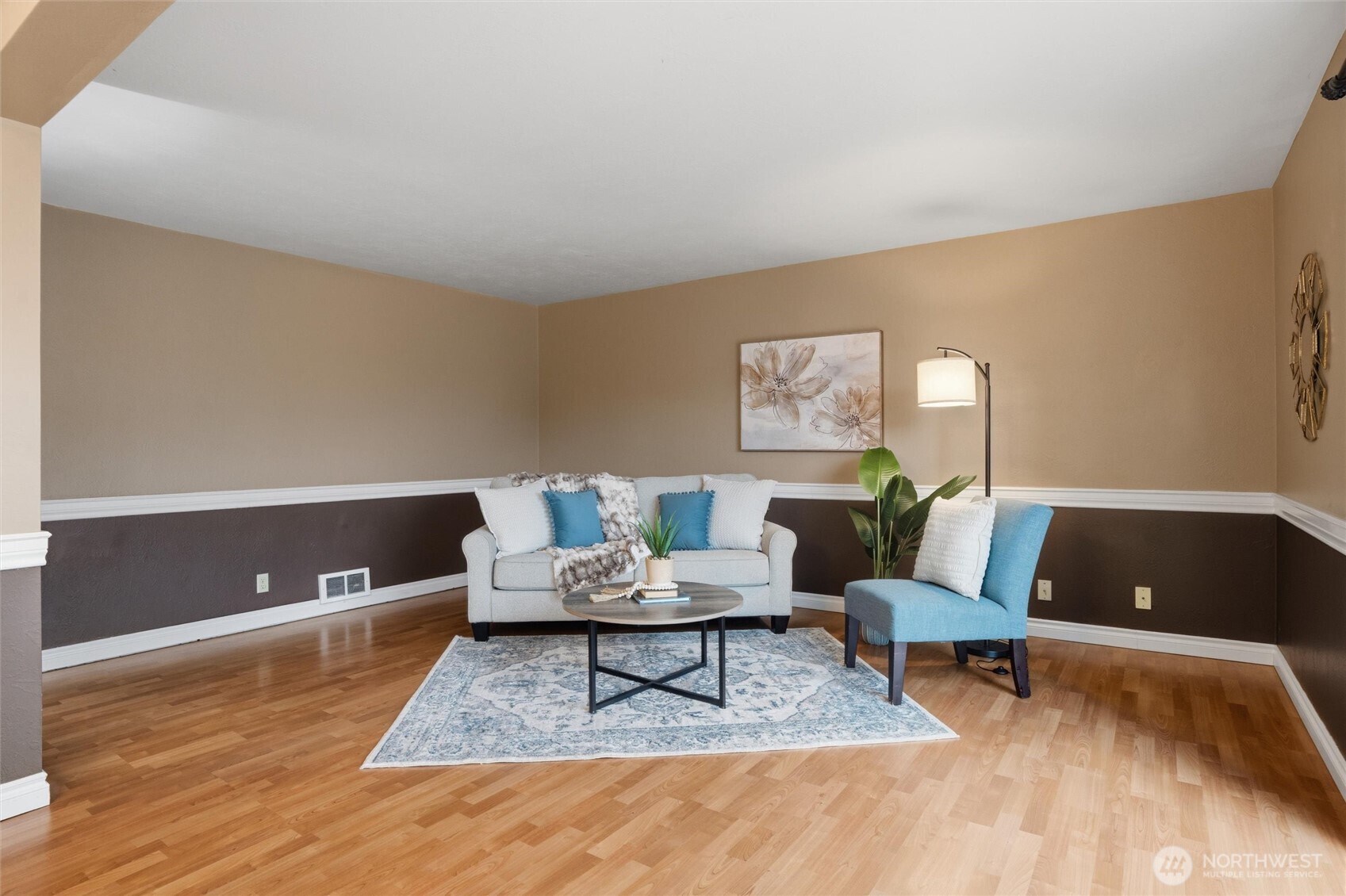 19855 Stavanger Loop Northeast Poulsbo, WA 98370 - Photo 21 of 37 a living room with furniture and a wooden floor