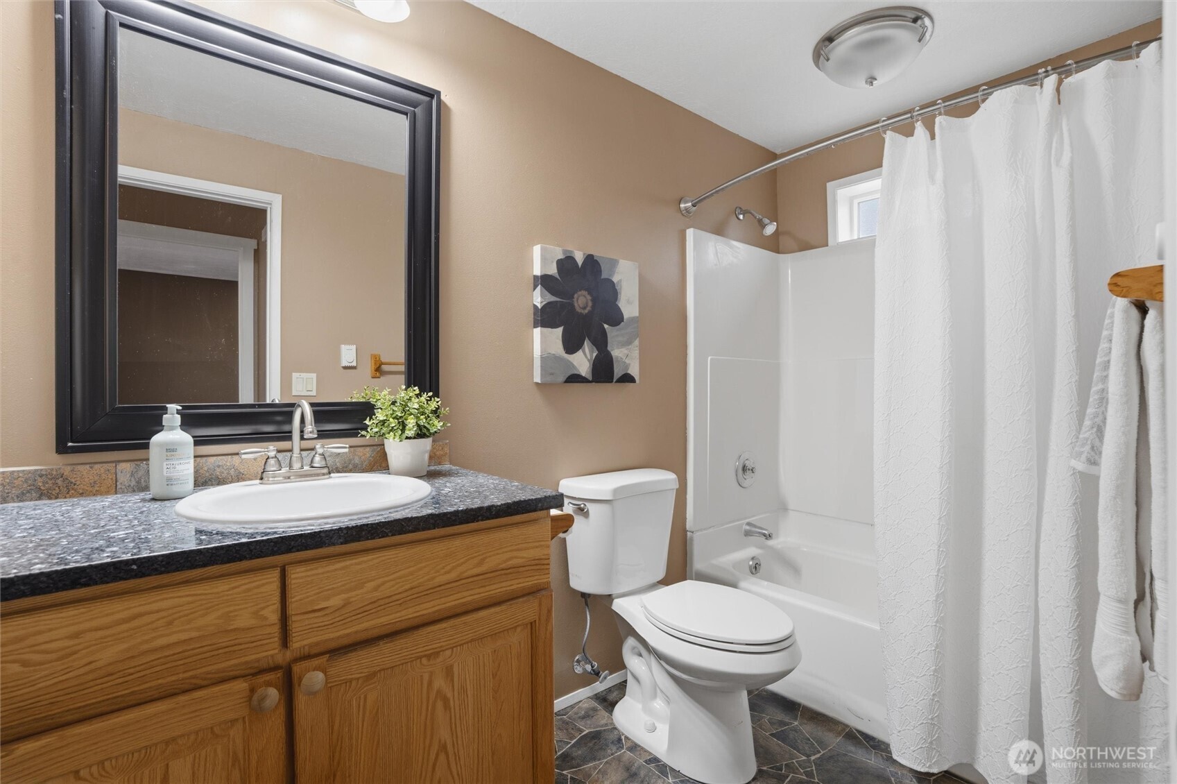 19855 Stavanger Loop Northeast Poulsbo, WA 98370 - Photo 26 of 37 a bathroom with a granite countertop sink toilet and shower
