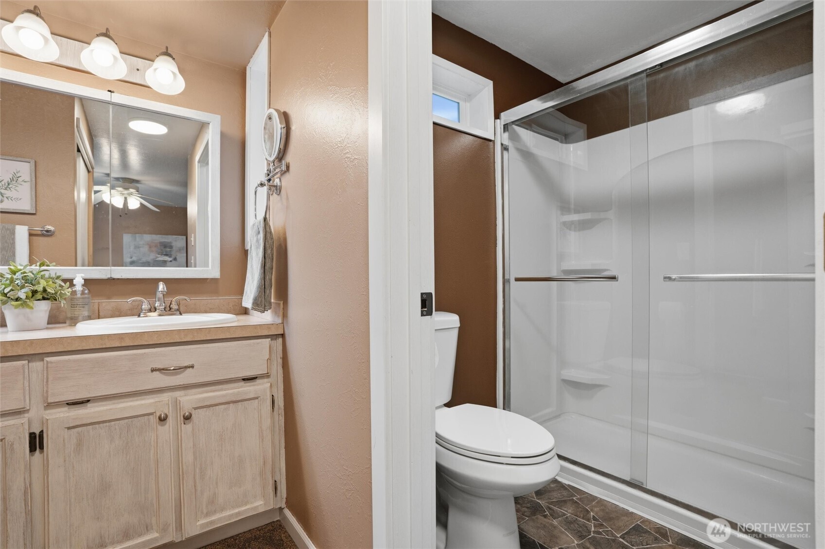 19855 Stavanger Loop Northeast Poulsbo, WA 98370 - Photo 30 of 37 a bathroom with a sink toilet and shower