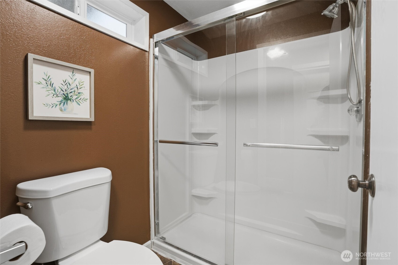 19855 Stavanger Loop Northeast Poulsbo, WA 98370 - Photo 31 of 37 a white toilet sitting next to a bathroom