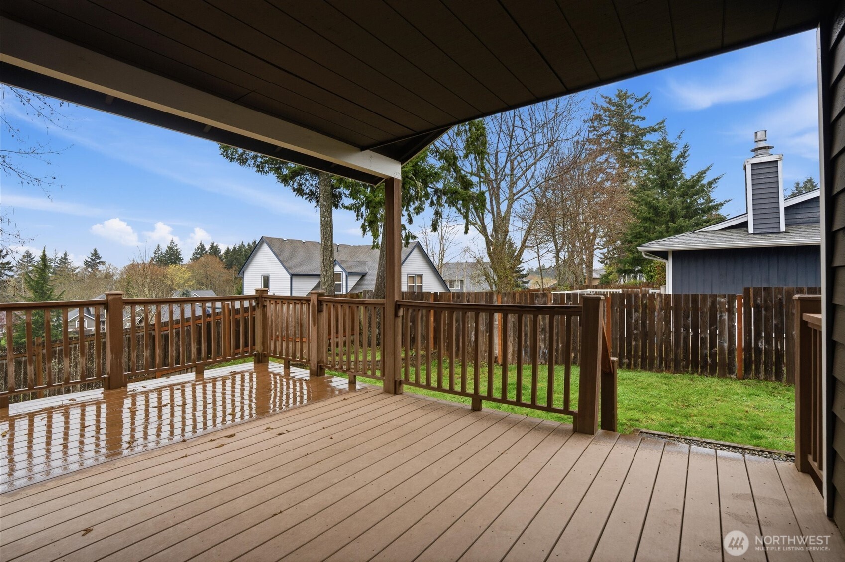19855 Stavanger Loop Northeast Poulsbo, WA 98370 - Photo 34 of 37 a view of a deck with wooden floor and wooden fence