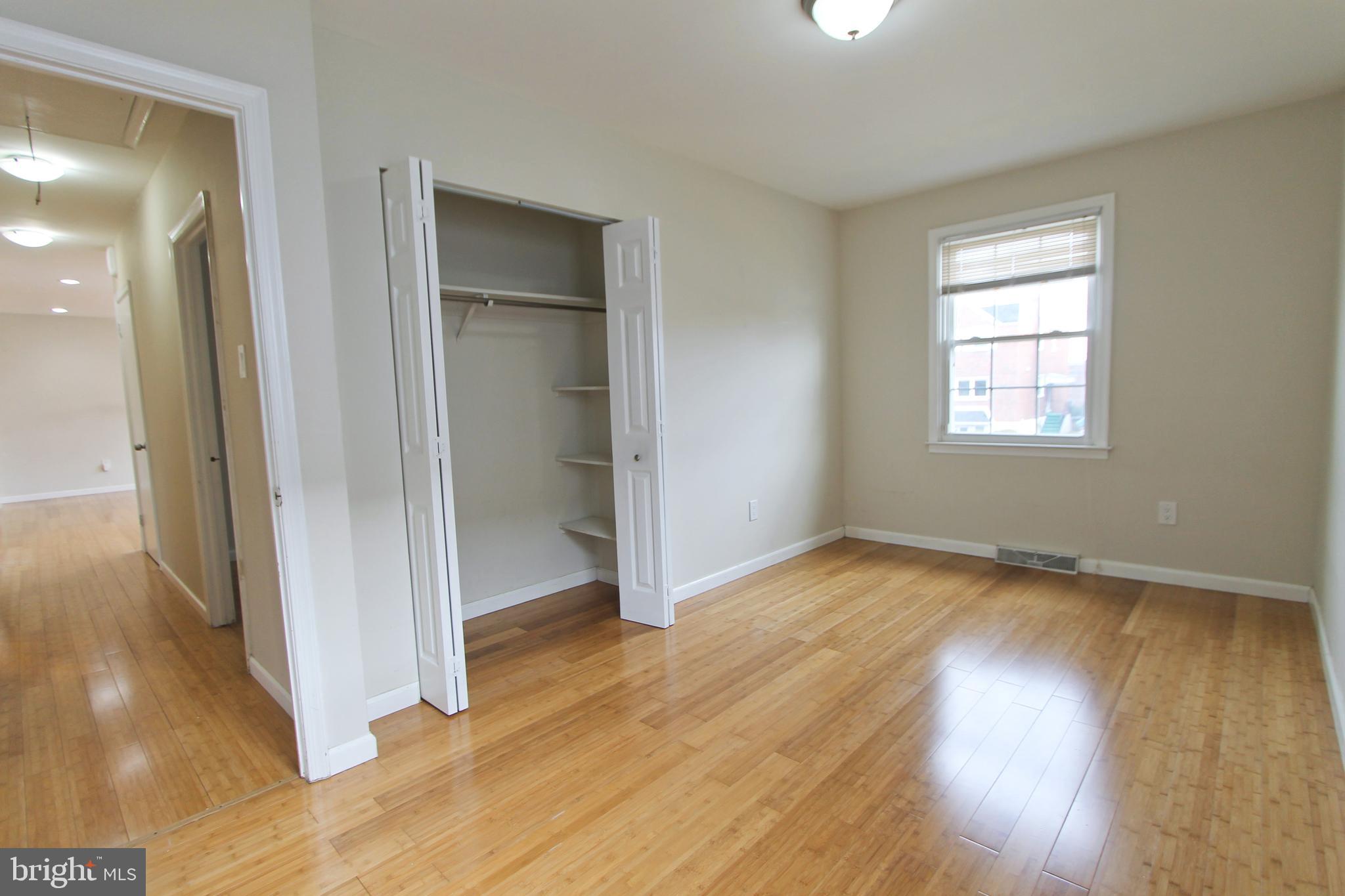 617 Renz Street Philadelphia, PA 19128 - Photo 11 of 28 an empty room with wooden floor and a window