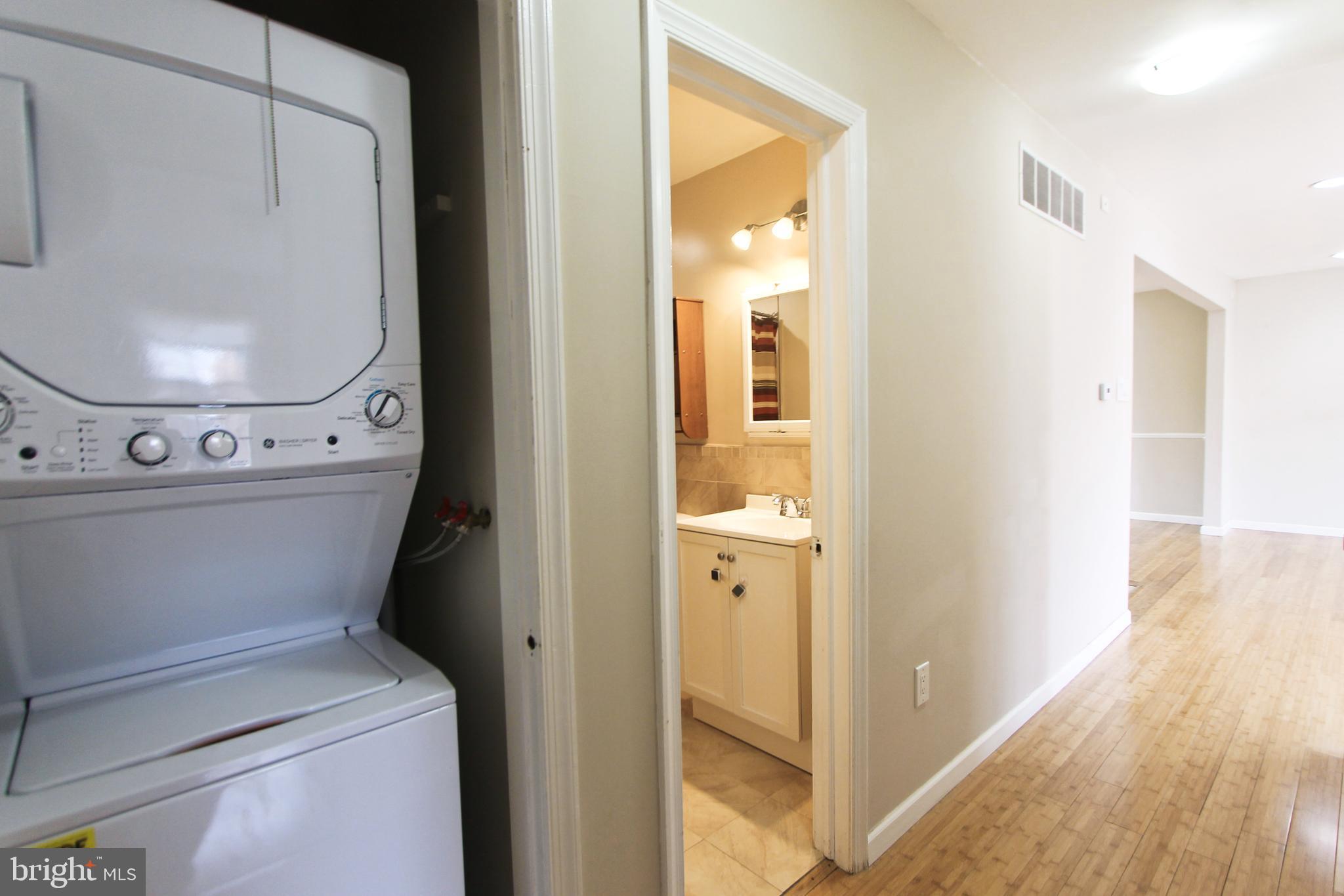 617 Renz Street Philadelphia, PA 19128 - Photo 19 of 28 a view of a hallway with washer and dryer