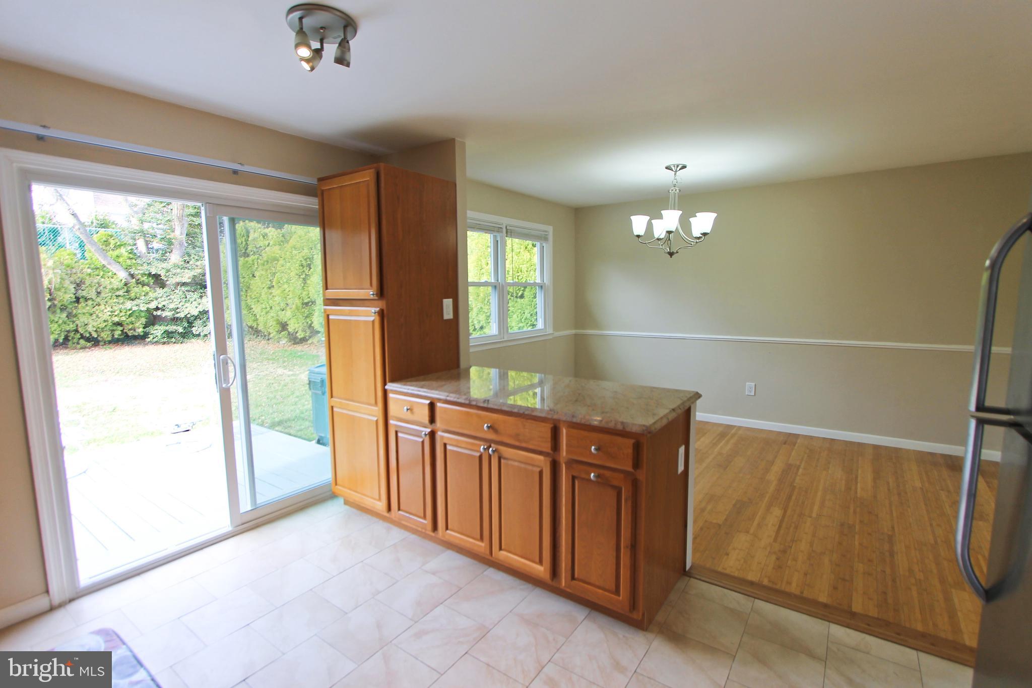 617 Renz Street Philadelphia, PA 19128 - Photo 22 of 28 a kitchen with stainless steel appliances granite countertop a refrigerator and a sink