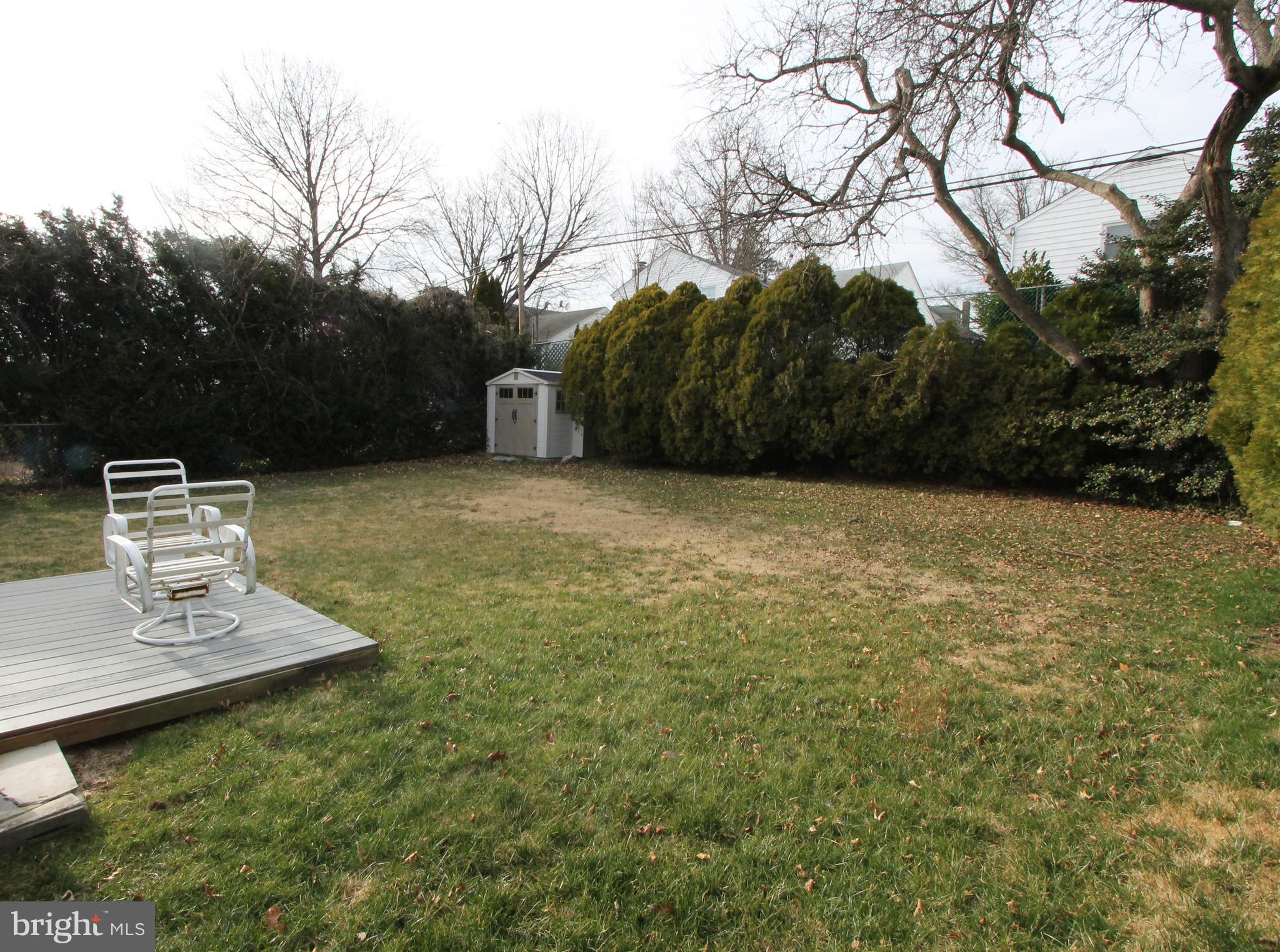 617 Renz Street Philadelphia, PA 19128 - Photo 3 of 28 a backyard of a house with table and chairs