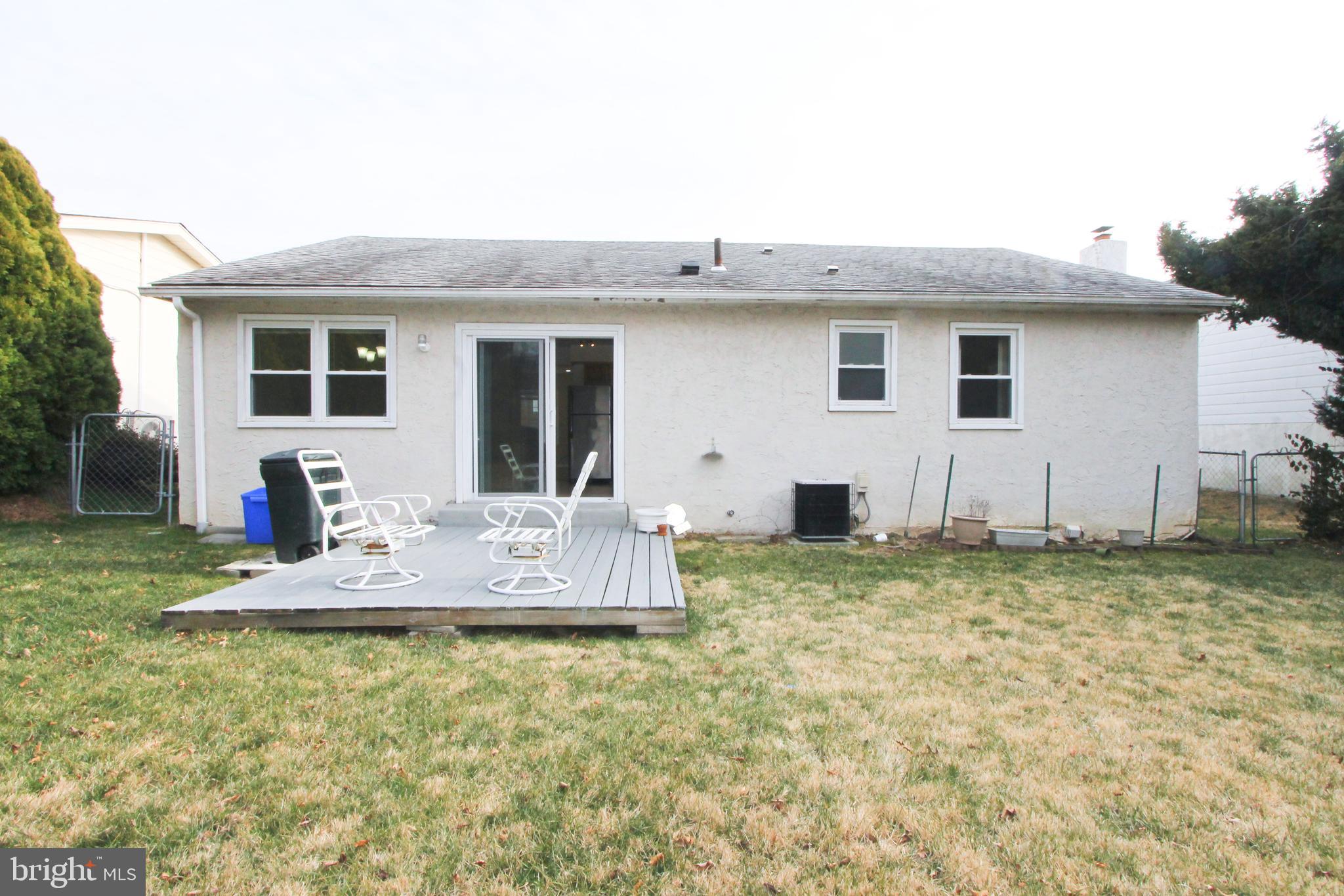 617 Renz Street Philadelphia, PA 19128 - Photo 4 of 28 a view of a house with backyard and chairs