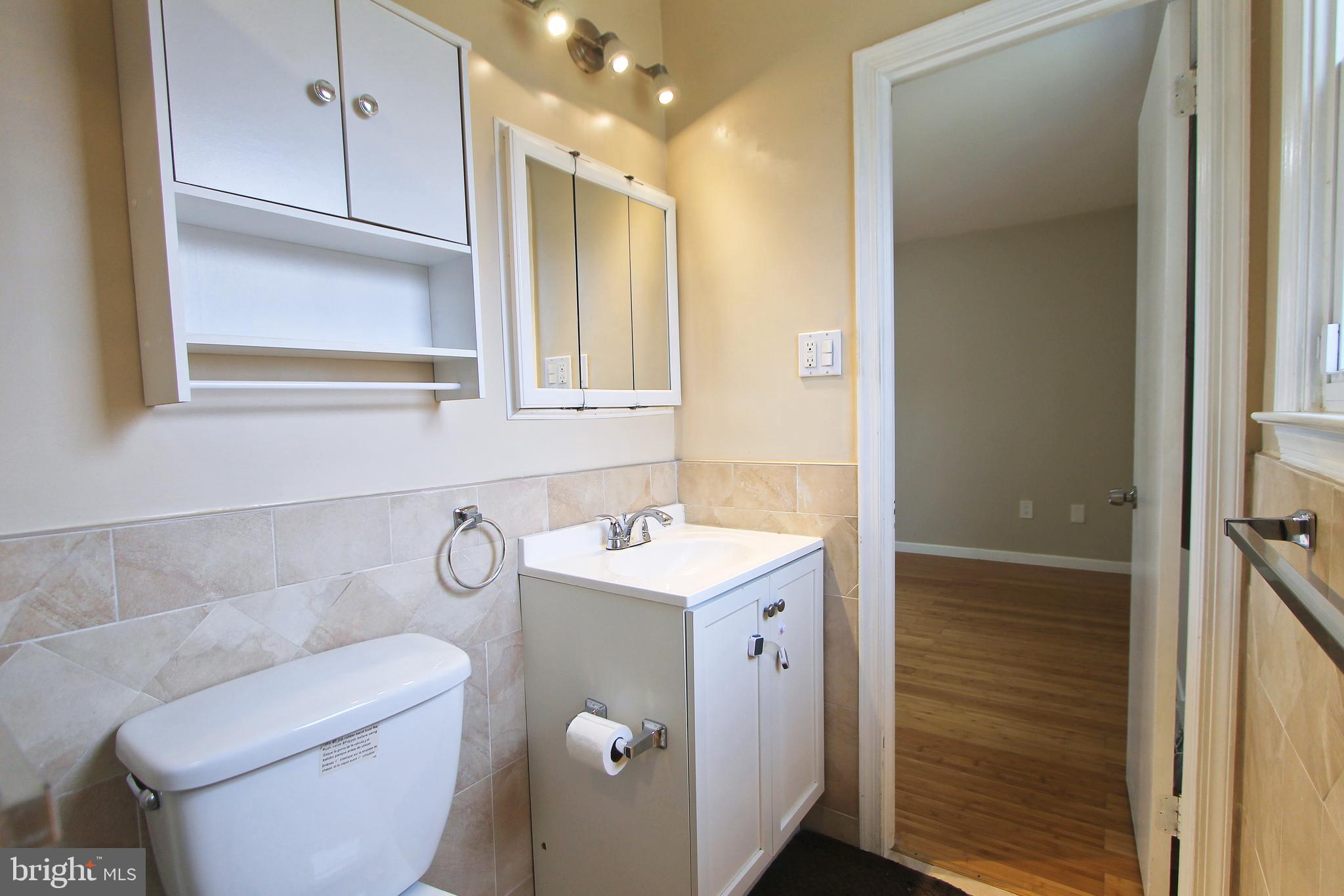 617 Renz Street Philadelphia, PA 19128 - Photo 5 of 28 a bathroom with a sink a toilet and shower
