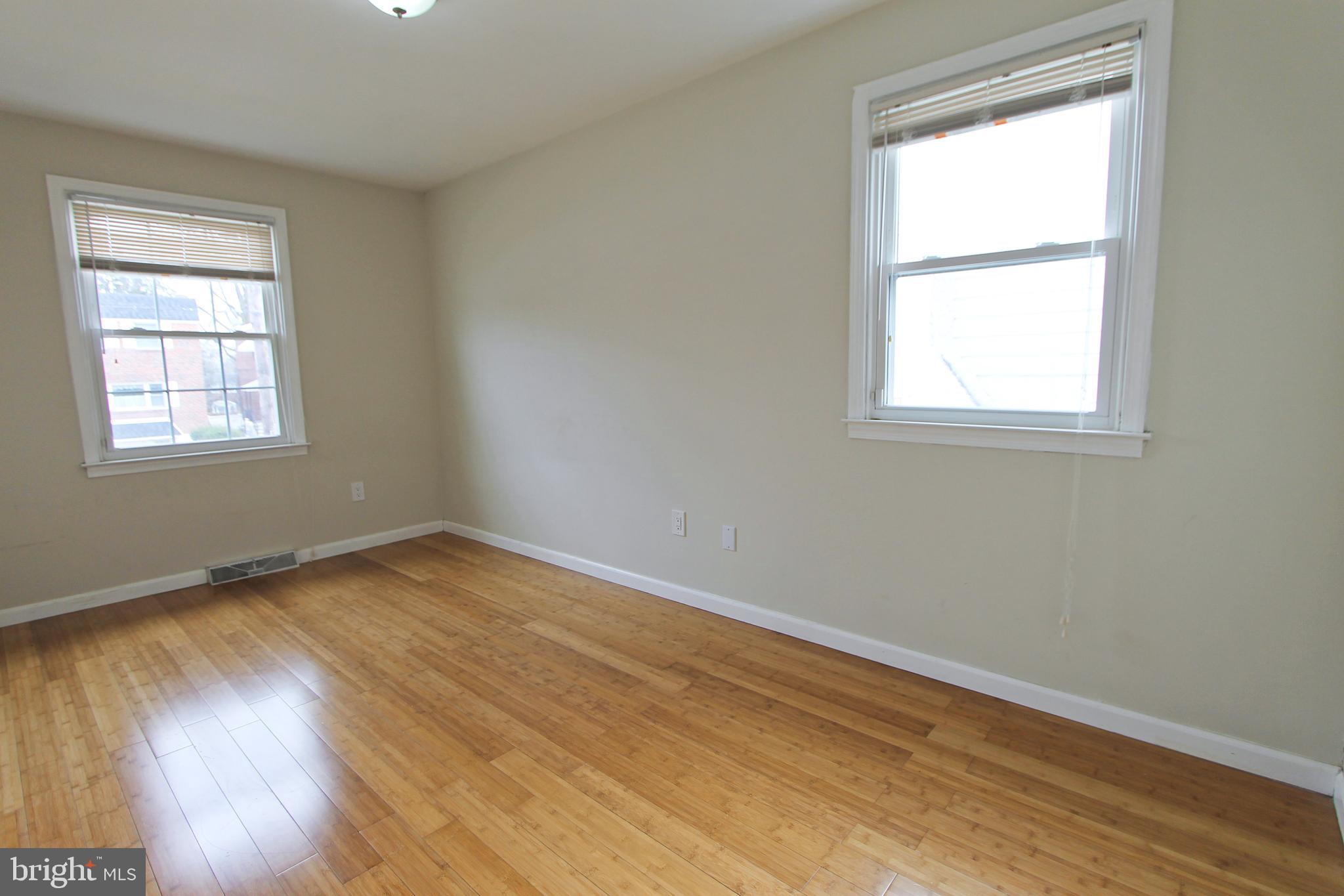 617 Renz Street Philadelphia, PA 19128 - Photo 10 of 28 an empty room with wooden floor and windows