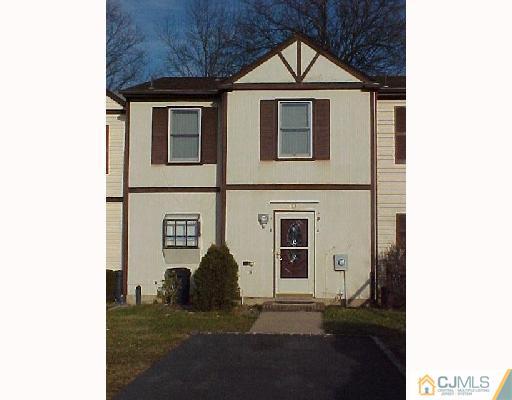 63 Redbud Road Piscataway, NJ 08854 - Photo 1 of 6 a front view of a house with a yard