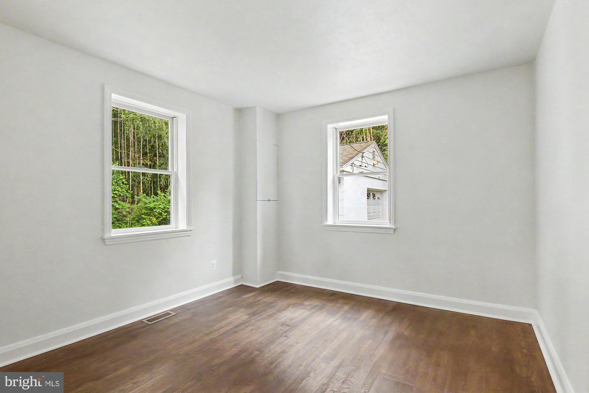 604 Prospect Mill Road Bel Air, MD 21015 - Photo 24 of 36 a view of an empty room with wooden floor and a window