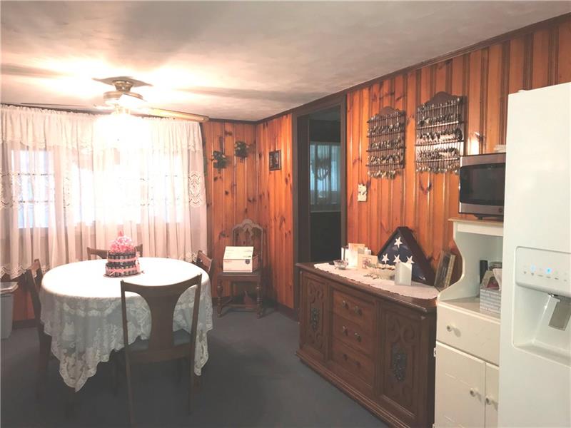 380 Dillon Road Acme, PA 15610 - Photo 5 of 25 The windows behind the dining room table look out to the front patio. Even though there's air conditioning you'll see several ceiling fans as we walk through the home. Off to the right is the main entrance and the den.