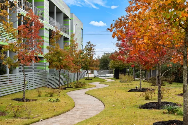 a swimming pool with trees in the background