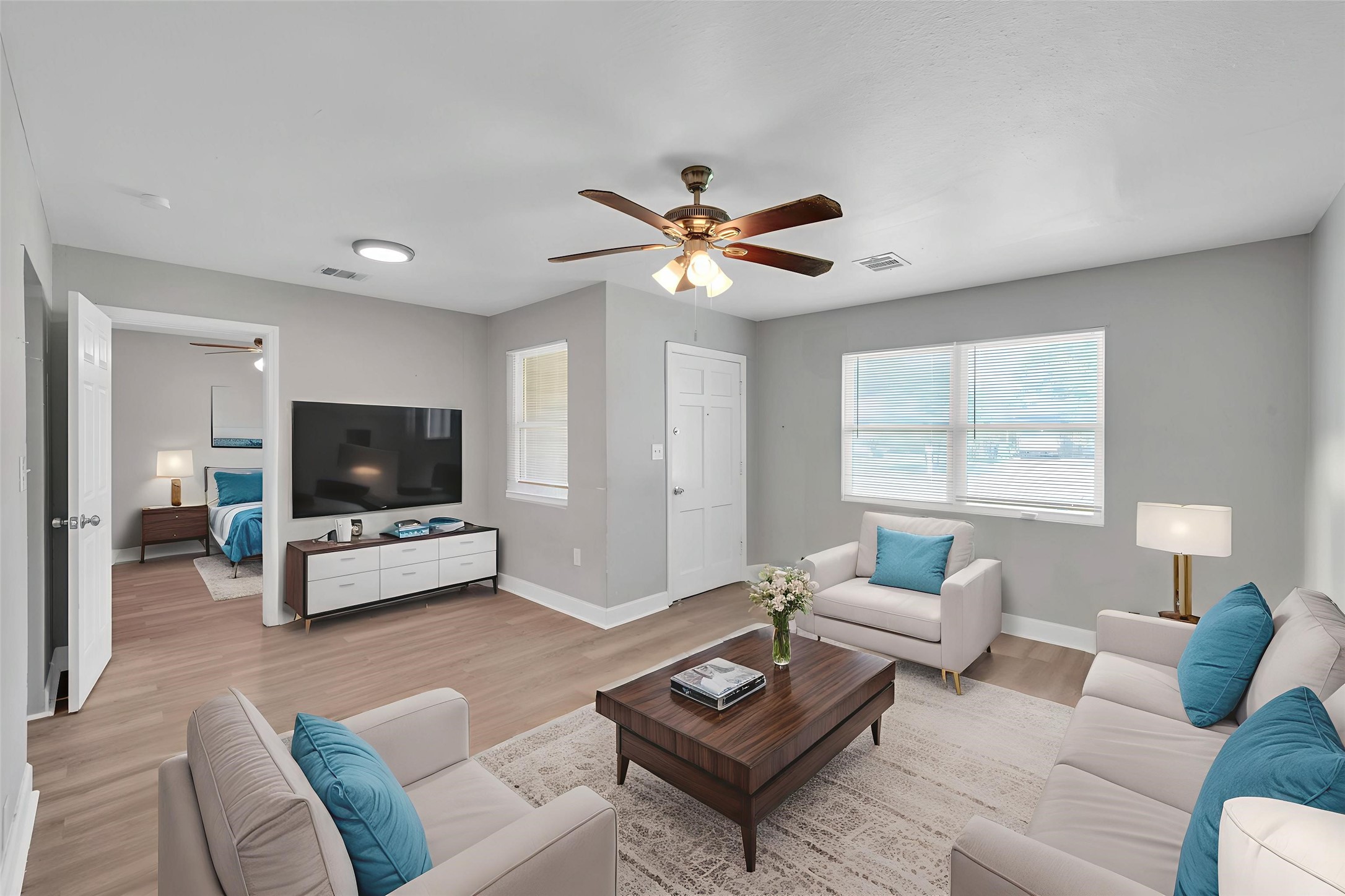 a living room with furniture and a flat screen tv