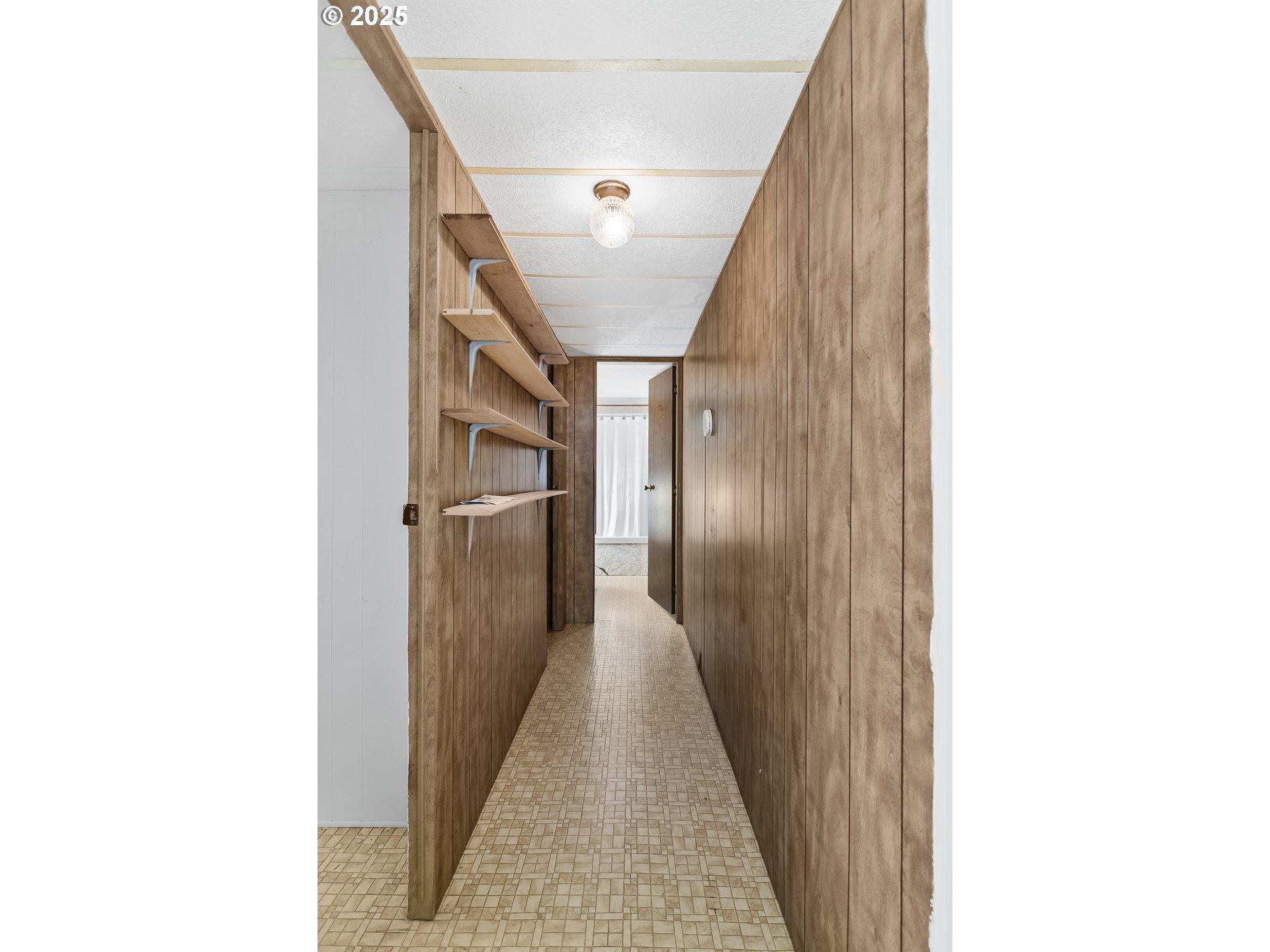 15779 Highway 42 Myrtle Point, OR 97458 - Photo 10 of 33 a view of a hallway with wooden floor