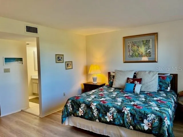 a bedroom with bed and window