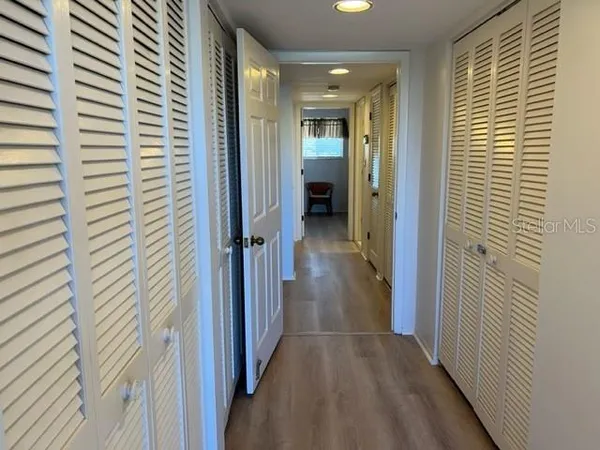 a view of a hallway with a door