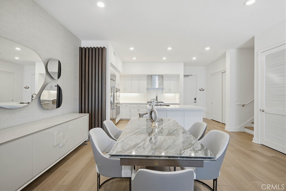 1604 Rivington Irvine, CA 92612 - Photo 13 of 75 a dining room with furniture a window and wooden floor
