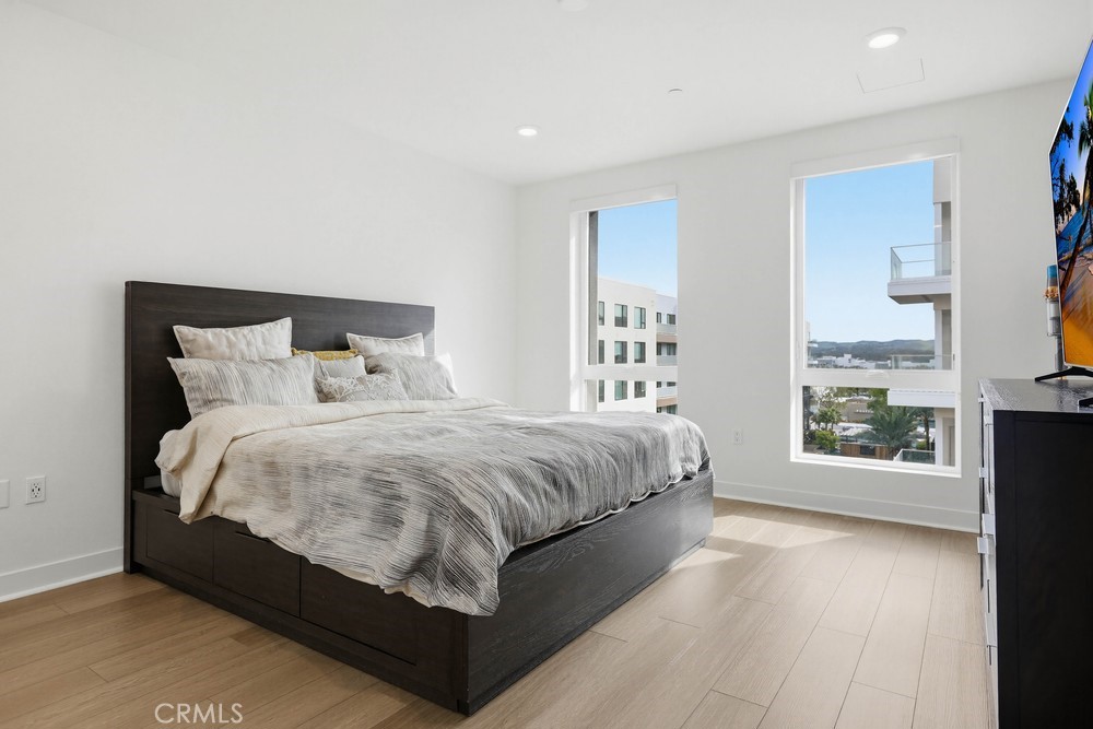 1604 Rivington Irvine, CA 92612 - Photo 55 of 75 a large bed sitting in a bedroom next to a window