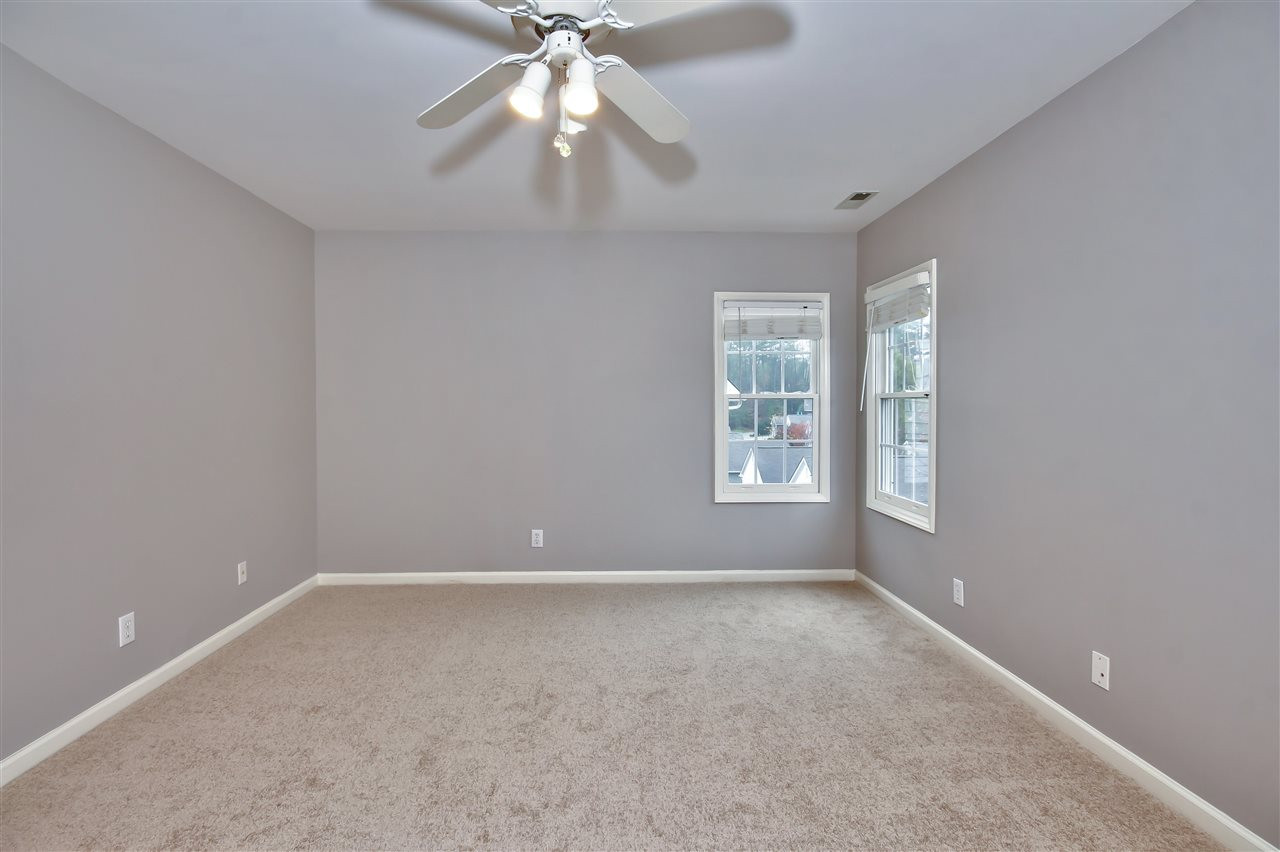 209 Chancellors Ridge Drive Durham, NC 27713 - Photo 14 of 24 The Master Suite is enhanced by lush carpeting, a large walk-in closet and a private bath. Master Bedroom