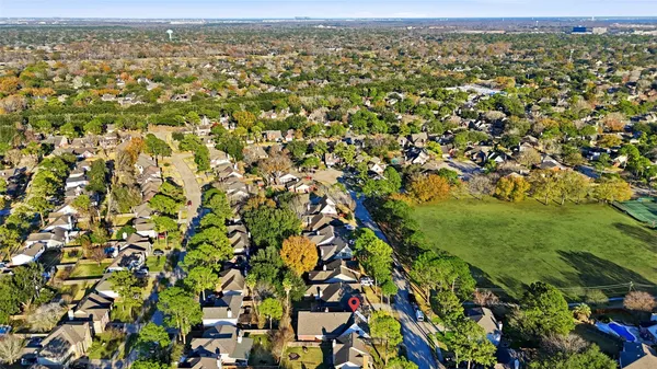 an aerial view of a city with lots of trees