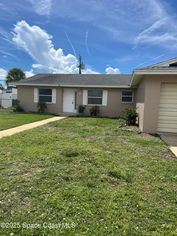 a house view with a garden space