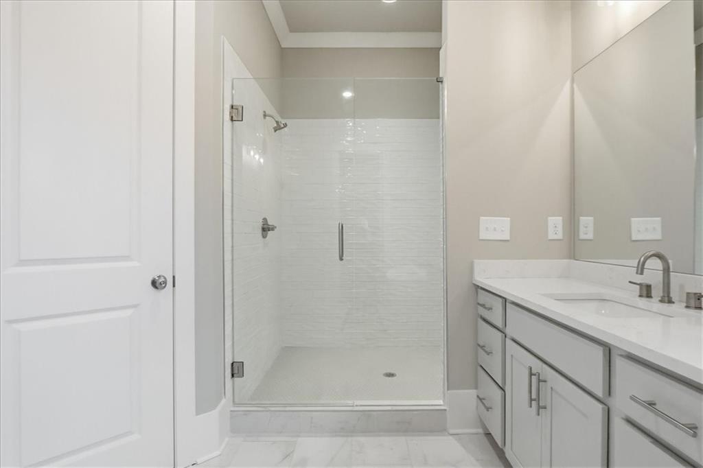 216 Ewing Way Dacula, GA 30019 - Photo 62 of 80 a bathroom with a shower and a sink