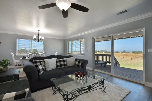 a view of a hallway with closet and window