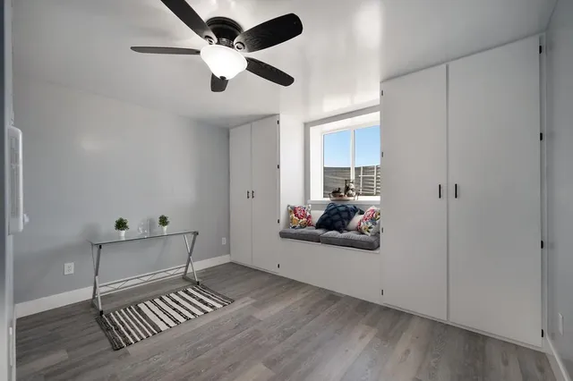 a view of a house with a yard and sitting area