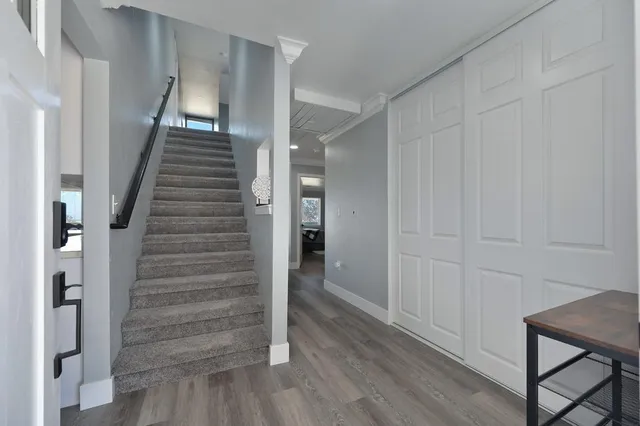 a kitchen with stainless steel appliances a sink stove and cabinets