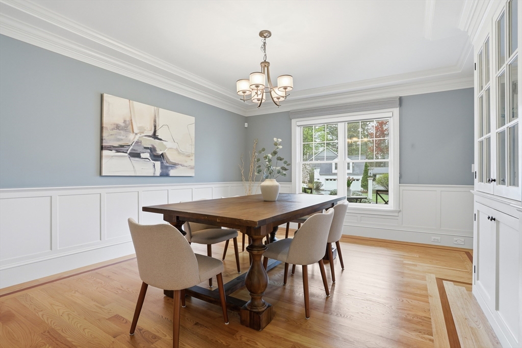 27 Maxwell Road Bedford, MA 01730 - Photo 13 of 42 a view of a dining room with furniture window and wooden floor