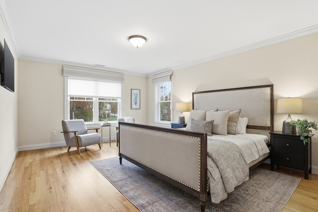 27 Maxwell Road Bedford, MA 01730 - Photo 22 of 42 a bedroom with bed and large windows