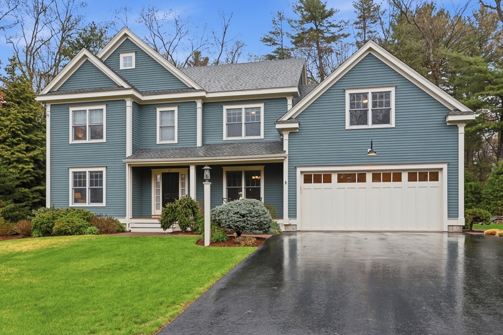 27 Maxwell Road Bedford, MA 01730 - Photo 40 of 42 a front view of a house with garden
