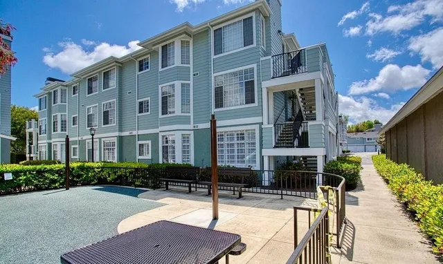 a view of a building with a yard