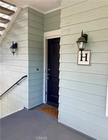 a view of wooden door and brick wall
