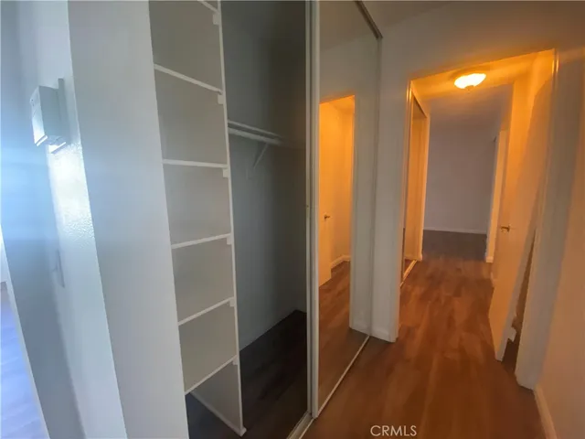 a view of hallway with wooden floor