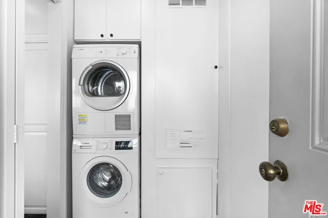 a view of livingroom with washer and dryer
